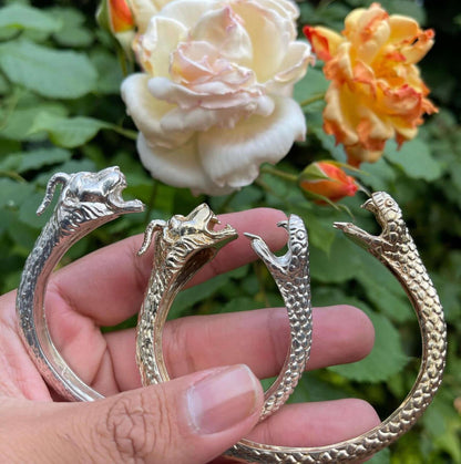 Chimaera CuffA sculptural and whimsical bracelet meticulously hand designed. One head features a horned lion, the other a serpent ready to attack. The cuff is adjustable and designed to make a ferocious statement. This piece is based on the Chimaera; a fi