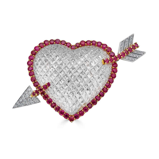 Sabbadini Two-Color Gold, Carved Rock Crystal, Ruby and Diamond Heart Clip-BroochA fabulous and sophisticated brooch created by the iconic Sabbadini brand. 18 kt., the large bombé rock crystal heart carved in a domed diamond-shaped pattern, edged by 44 ro