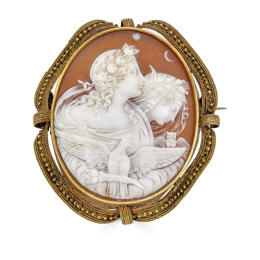 Architectural Revival Cameo of Day and NightA beautiful and large Victorian Era cameo depicting two greek gods likely Day and Night. We love cameos and this one is especially lovely. There is lovely Etruscan revival style granulation around the scrolled s