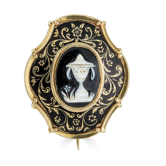 Victorian Mourning Brooch with Banded Agate Neoclassical UrnThis piece of victorian mourning jewelry is exquisite. The central banded agate is carved to perfection and has a neoclassical style urn and what appears to be a forget me not flower. Black ename