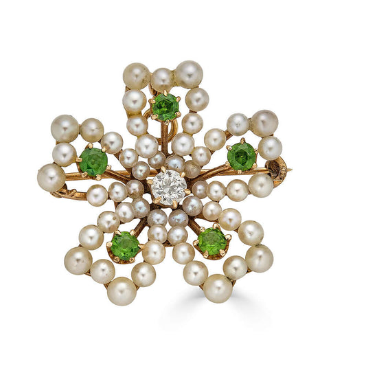 Seed Pearl, Diamond & Dementoid Garnet Floral Pendant BroochThis lovely brooch can be worn either as a pendant or brooch. Bright dementoid garnet stones add the perfect amount of color. The seed pearls are decadent and the central diamond is simply to die