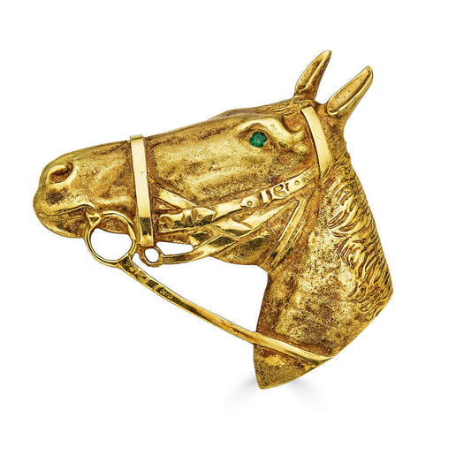 Large Vintage Horse Brooch with Emerald EyeCalling all ranchers and animal lovers! This substantial brooch is expertly crafted in solid 18k gold and packs a punch. This brooch is extremely detailed; you can even see it's mane and texture of its skin. Can