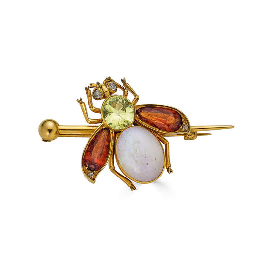 Colorful Opal, Peridot, and Tourmaline Insect PinOne of our favorite new finds. This insect doesn't disappoint. A lovely central peridot stone set into its thorax, a clear opal abdomen, tourmaline wings, and diamonds set into the eyes and the tips of the