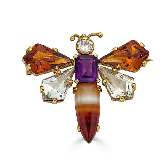 Vintage Gemstone Insect BroochA whimsical take on the insect brooch. This beautiful butterfly features agate, amethyst, citrine, and quartz stones. A really lovely splash of color. Perfect for a spring soiree or a prance in the garden. Condition: Normal a